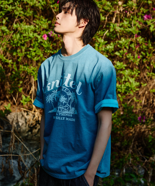 KNITTED(ニッティド)の「(ユニセックス) ピグメント パームツリー グラフィック Tシャツ ストーンブルー(Tシャツ/カットソー・メンズ・その他・MEDIUM/LARGE/X-LARGE)」の1枚目の写真