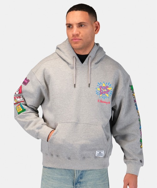 Alpha Industries(アルファインダストリーズ)の「Alpha Industries/アルファインダストリーズ/Keith Haring X Alpha POP SHOP GRAPHIC HOODIE/ キース へリング ポップアップ ショップ グラフィック フーディー(パーカー・メンズ・グレー・MEDIUM/X-LARGE/LARGE/SMALL)」の9枚目の写真