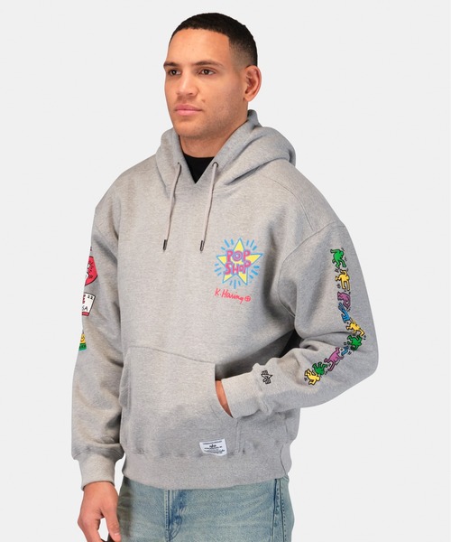 Alpha Industries(アルファインダストリーズ)の「Alpha Industries/アルファインダストリーズ/Keith Haring X Alpha POP SHOP GRAPHIC HOODIE/ キース へリング ポップアップ ショップ グラフィック フーディー(パーカー・メンズ・グレー・MEDIUM/X-LARGE/LARGE/SMALL)」の10枚目の写真