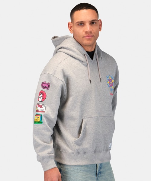 Alpha Industries(アルファインダストリーズ)の「Alpha Industries/アルファインダストリーズ/Keith Haring X Alpha POP SHOP GRAPHIC HOODIE/ キース へリング ポップアップ ショップ グラフィック フーディー(パーカー・メンズ・グレー・MEDIUM/X-LARGE/LARGE/SMALL)」の11枚目の写真