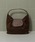 lawgy�i���E�W�[�j�́ubrushed material flap point bag / �u���b�V���h�}�e���A���t���b�v�|�C���g�o�b�O�i�n���h�o�b�O�j�v�b�u���E��