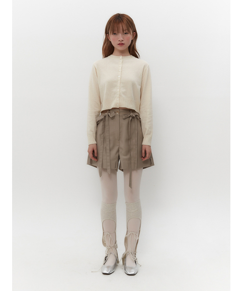 TUOMIO（トゥオミオ）の「BUTTON POINT CARDIGAN [IVORY]（カーディガン/ボレロ・レディース・その他・1/2）」の2枚目の写真