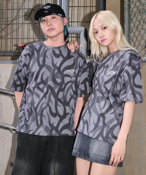 SHORT ROUND(ショートラウンド)の「SHORT ROUND/トライバルワンポイントロゴT(Tシャツ/カットソー・メンズ・その他1・MEDIUM/LARGE)」の1枚目の写真