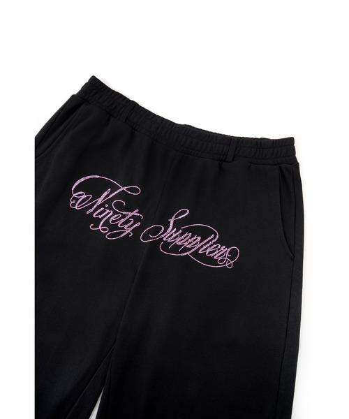 SUPPLIER(サプライヤー)の「スエットパンツ|9090 x SUPPLIER Rhinestone Logo Curve Sweat Pants|SUPPLIER(スウェットパンツ・メンズ・ブラック・SMALL/MEDIUM)」の8枚目の写真
