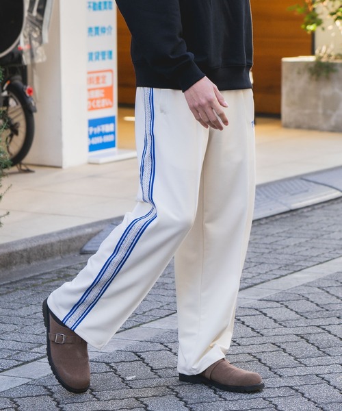 THRASHER(スラッシャー)の「【THRASHER/スラッシャー】【高級感あるジャガードテープが際立つ1本】サイドライン ジャージワイドトラックパンツ ブランドロゴ刺繍 きれいめ ストリート スケーター ユニセックス(その他パンツ・メンズ・ホワイト/ブラック・MEDIUM/LARGE)」の8枚目の写真