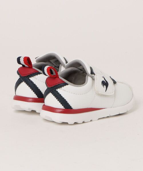 le coq sportif（ルコックスポルティフ）の「le coq sportif ルコックスポルティフ LCS MONTPELLIER 6 F【脱ぎ履き簡単】ベビーシューズ(LCSモンペリエ6F)（スニーカー・キッズ・ホワイト系その他/ホワイト×ネイビー・15.0cm/16.0cm/14.0cm/13.0cm）」の3枚目の写真