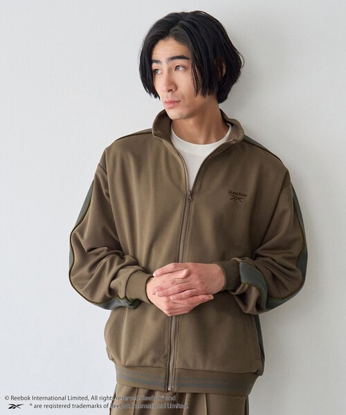 coen(コーエン)の「Reebok(リーボック)別注ジャージトラックジャケット(ジャージ・メンズ・ダークブラウン/ダークグレー・S/L/M/XL)」の1枚目の写真