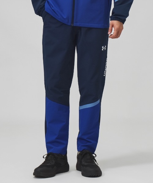 UNDER ARMOUR(アンダーアーマー)の「アンダーアーマー UNDER ARMOUR UAブラッシュドウーブン パンツ(その他パンツ・メンズ・ネイビー/ブラック×レッド/ブラック×グレー・S/3L/LL/M/L)」の1枚目の写真