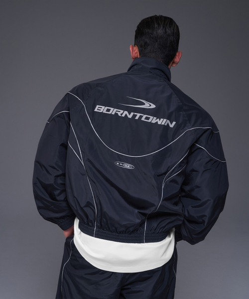 BORN TO WIN（ボーントゥウィン）の「WOVEN PIPING TRACK JACKET [NAVY]（ナイロンジャケット・メンズ・その他・1/2/4/3）」の4枚目の写真