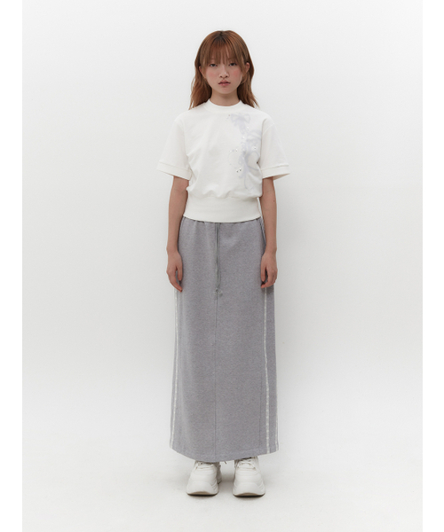 TUOMIO（トゥオミオ）の「RIBBON GRAPHIC MOCK NECK TOP [WHITE]（Tシャツ/カットソー・レディース・その他・1/2）」の2枚目の写真