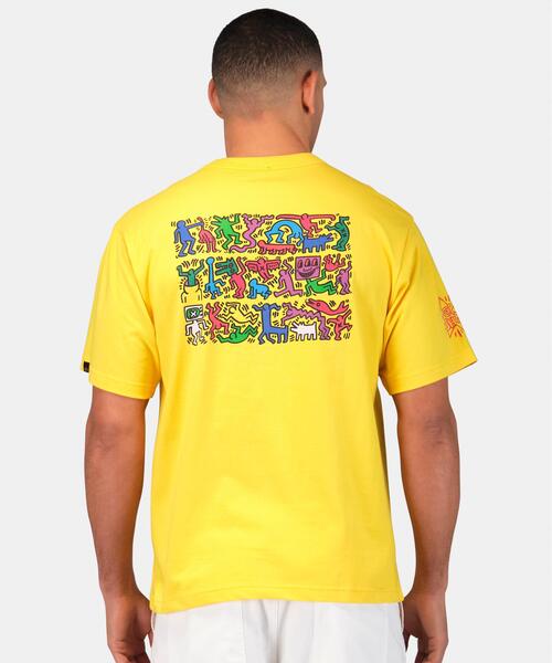 Alpha Industries（アルファインダストリーズ）の「Alpha Industries/アルファインダストリーズ/Keith Haring X Alpha GRAPHIC TEE HEART MAN/キースへリング グラフィック ティーシャツ ハートマン（Tシャツ/カットソー・メンズ・ホワイト/イエロー・X-LARGE/LARGE/MEDIUM/SMALL/X-SMALL）」の3枚目の写真