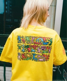 Alpha Industries（アルファインダストリーズ）の「Alpha Industries アルファインダストリーズ Keith Haring X Alpha GRAPHIC TEE HEART MAN キースへリング グラフィック ティーシャツ ハートマン（Tシャツ/カットソー）」