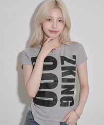 A'GEM/9 × .kom 『.KOM/ドットケーオーエム』アシメヘムグラフィックコンパクトTシャツ