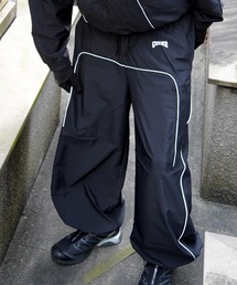 GUIDER（ガイダー）の「【GUIDER】リフレクター ナイロントラックパンツ【セットアップ対応】 / Reflector Nylon Track Pants（その他パンツ）」