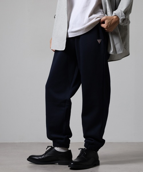 GUESS JEANS(ゲスジーンズ)の「GUESS JEANS GJ TRIANGLE LABEL JOGGER PANTS ゲス スウェット ジョガーパンツ コットン(スウェットパンツ・レディース・ネイビー/グレー・S/L/M)」の16枚目の写真