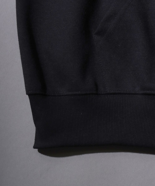 SITRY（シトリー）の「Cross ＆ Trival Logo Rinestone Sweat Zip Hoodie/クロスロゴ トライバルロゴ ラインストーン オーバーサイズ ショート丈 ダブルジップ ポンチ フルジップパーカー フーディー パーカー スウェット レディース メンズ（パーカー・メンズ・ホワイト/ブラック・M/L）」の3枚目の写真