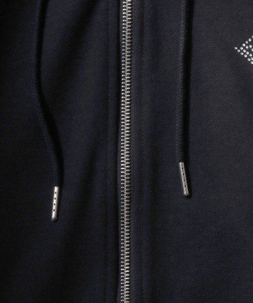 SITRY（シトリー）の「Cross ＆ Trival Logo Rinestone Sweat Zip Hoodie/クロスロゴ トライバルロゴ ラインストーン オーバーサイズ ショート丈 ダブルジップ ポンチ フルジップパーカー フーディー パーカー スウェット レディース メンズ（パーカー・メンズ・ホワイト/ブラック・M/L）」の18枚目の写真