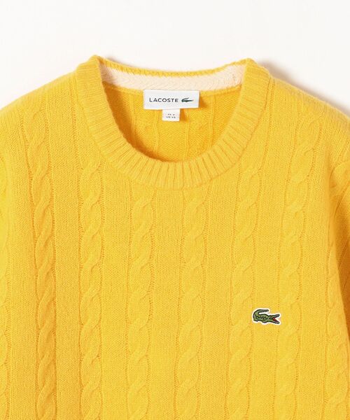 LACOSTE(ラコステ)の「LACOSTE: TORSADES ケーブルニット(ニット/セーター・レディース・オフホワイト/イエロー・ONE SIZE)」の4枚目の写真
