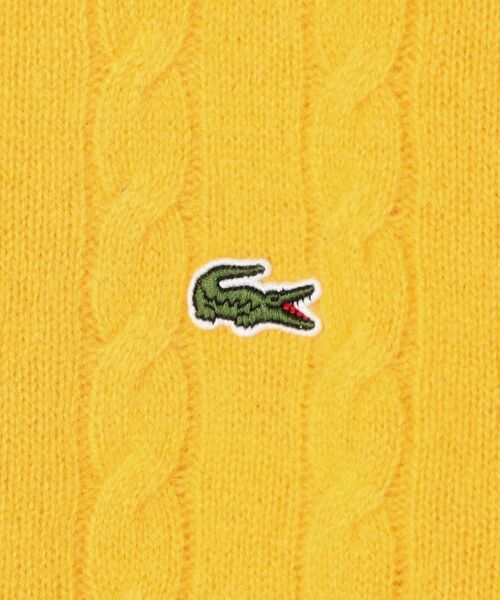 LACOSTE(ラコステ)の「LACOSTE: TORSADES ケーブルニット(ニット/セーター・レディース・オフホワイト/イエロー・ONE SIZE)」の3枚目の写真