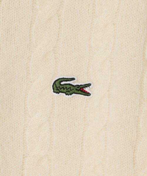 LACOSTE(ラコステ)の「LACOSTE: TORSADES ケーブルニット(ニット/セーター・レディース・オフホワイト/イエロー・ONE SIZE)」の8枚目の写真