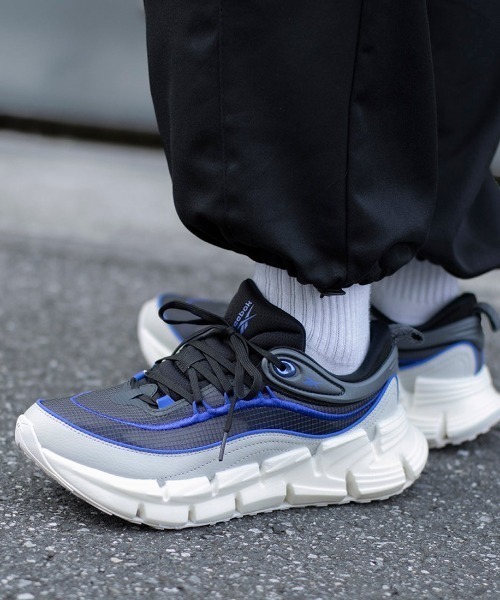 Reebok(リーボック)の「フロートジグ アンコール / FLOATZIG ENCORE(スニーカー・メンズ・ブラック×ホワイト/アイボリー/ブラック・29.0cm/25.0cm/30.0cm/28.5cm/28.0cm/27.5cm/27.0cm/25.5cm/31cm/26.5cm/26.0cm)」の1枚目の写真