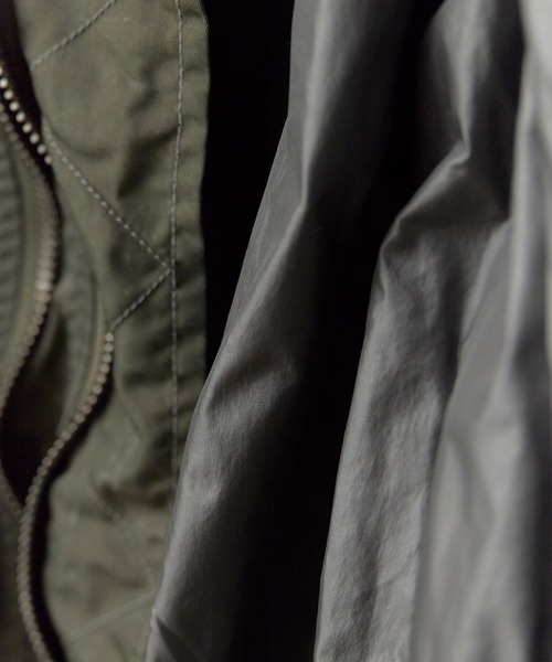 FACETASM(ファセッタズム)の「FACETASM/ファセッタズム ZIPPER BUG MA-1 シガレットポケット ユーズド加工ブルゾン 2026年春夏(MA-1・レディース・カーキ・00)」の4枚目の写真