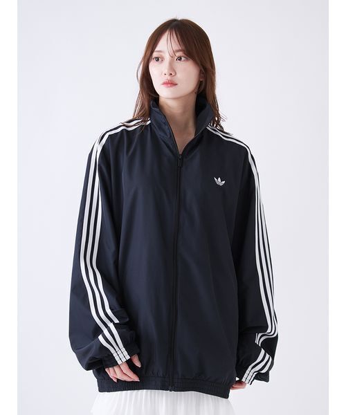 adidas(アディダス)の「【adidas Originals】FIRE BIRD ADILENIUM TT/ファイヤーバードアディレニウムトラックジャケット(ブルゾン・レディース・ブラック・XS)」の6枚目の写真