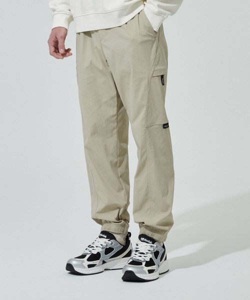 KODAK(コダック)の「コーデュラセミワイドフィットジョガーパンツ BEIGE(スウェットパンツ・メンズ・その他・LARGE/SMALL/MEDIUM/X-LARGE)」の1枚目の写真