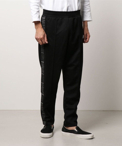 GOLDEN GOOSE（ゴールデングース）の「GOLDEN GOOSE Track pants Game EDT Capsule Collection in black with logoed side line（その他パンツ・メンズ・ブラック系その他・X-SMALL/SMALL/MEDIUM/LARGE）」の5枚目の写真