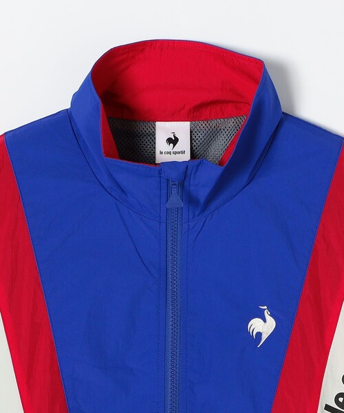le coq sportif(ルコックスポルティフ)の「le coq sportif:〈撥水加工/洗濯機可能〉ナイロン ウィンドブレーカー ジャケット(ナイロンジャケット・レディース・ネイビー/ブルー・ONE SIZE)」の6枚目の写真