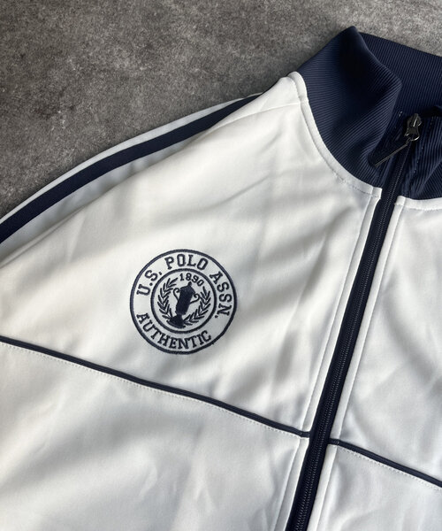U.S. POLO ASSN.(ユーエスポロアッスン)の「【U.S. POLO ASSN.】トラックジャケット(ブルゾン・レディース・アイボリー/ネイビー/ブラウン・LARGE/MEDIUM)」の21枚目の写真