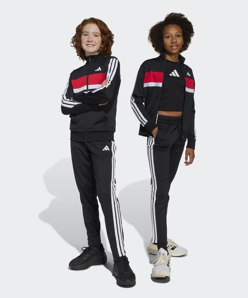adidas(アディダス)の「シーズナル エッセンシャルズ Tiberio スリーストライプス トリコット トラックスーツ キッズ / ジャージ / アディダス adidas(ジャージ・キッズ・ブラック×グレー/ブラック×レッド/ブルー・130/140/150/160)」の3枚目の写真