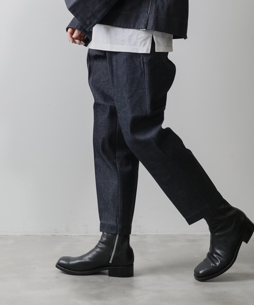 KAZUYUKI KUMAGAI ATTACHMENT（カズユキクマガイアタッチメント）の「11oz DENIM TAPERED TROUSERS DENIM（デニムパンツ・メンズ・ネイビー/ブラック・3/1/2）」の2枚目の写真