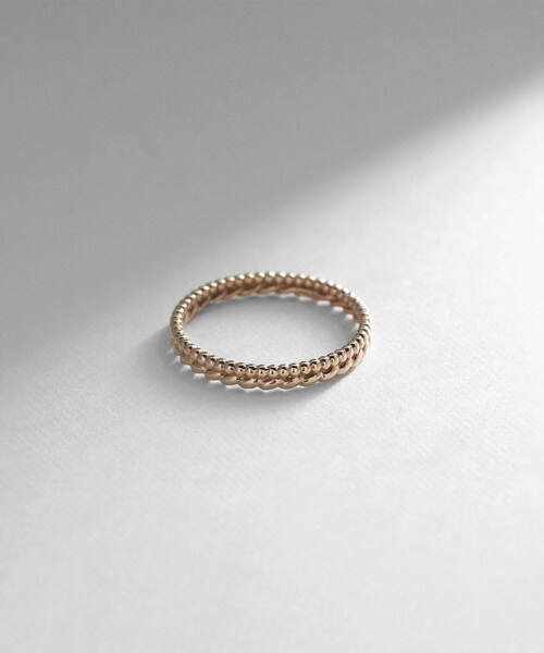 COCOSHNIK(ココシュニック)の「K10丸玉×縄目 リング(リング・レディース・ホワイト系その他7・12号/14号/10号)」の1枚目の写真
