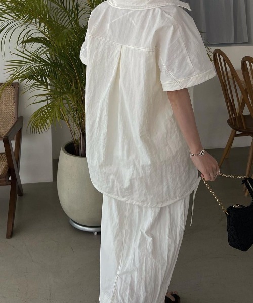 WILLFULLY（ウィルフリー）の「bi color stitch flap pocket pencil nylon SK（スカート・レディース・アイボリー/ブラック・FREE）」の4枚目の写真