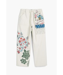 Desigual（デシグアル）の「ボタニカル パッチプリント コットン ロングパンツ（デニムパンツ）」