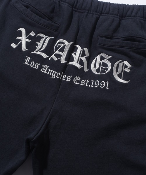 XLARGE(エクストララージ)の「OLD ENGLISH SWEAT PANTS(スウェットパンツ・メンズ・ブラック/オリーブ/アッシュ/ネイビー・S/M/L/XL)」の11枚目の写真