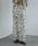 MANOF�i�}�m�t�j�́uBLURRED FLOWER WIDE PANTS�i���̑��p���c�j�v�b�A�C�{���[