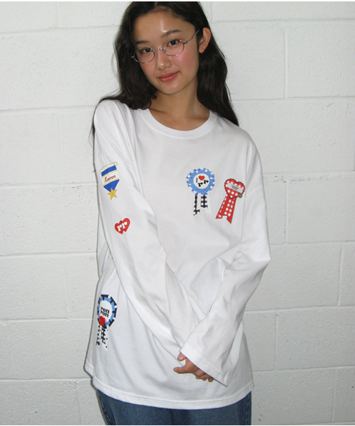 RONRON(ロンロン)の「ROSETTE BUTTON OVER FIT LONG SLEEVE WHITE(Tシャツ/カットソー・レディース・その他・FREE)」の1枚目の写真