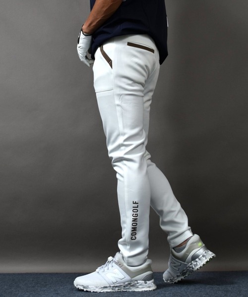 COMON GOLF(コモンゴルフ)の「サイドロゴ入り ポンチ素材 テーパード ゴルフパンツ(スウェットパンツ・メンズ・ホワイト×グリーン/ホワイト×ブラウン・XXXL/M/XL/L/XXL)」の2枚目の写真