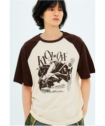 NASTY KICK（ナスティーキック）の「A'GEM/9 × .kom 『NASTY KICK/ナスティー キック』 Pitchy Raglan Tee/ピッチーラグラン 半袖Tシャツ（Tシャツ/カットソー）」
