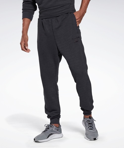 Reebok(リーボック)の「トレーニング エッセンシャルズ メランジ ジョガー / Training Essentials Melange Joggers(スウェットパンツ・メンズ・ブラック/ヘザーグレー・XXX-LARGE/LARGE/MEDIUM/X-LARGE/SMALL/XX-LARGE/X-SMALL)」の2枚目の写真