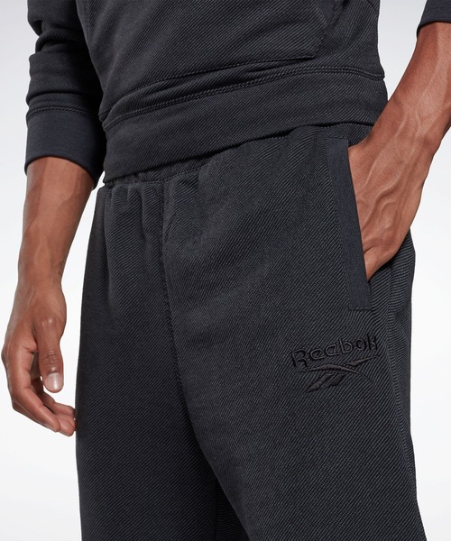 Reebok(リーボック)の「トレーニング エッセンシャルズ メランジ ジョガー / Training Essentials Melange Joggers(スウェットパンツ・メンズ・ブラック/ヘザーグレー・XXX-LARGE/LARGE/MEDIUM/X-LARGE/SMALL/XX-LARGE/X-SMALL)」の3枚目の写真