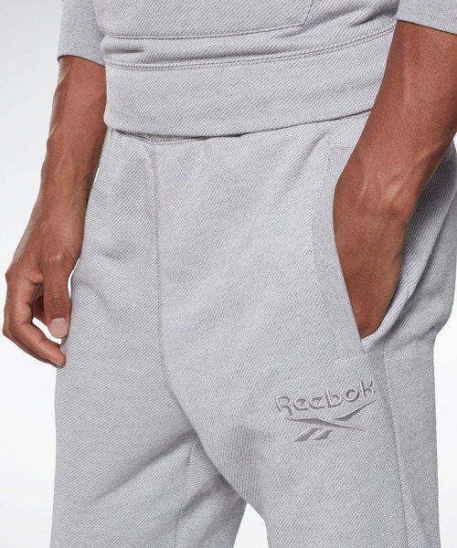 Reebok(リーボック)の「トレーニング エッセンシャルズ メランジ ジョガー / Training Essentials Melange Joggers(スウェットパンツ・メンズ・ブラック/ヘザーグレー・XXX-LARGE/LARGE/MEDIUM/X-LARGE/SMALL/XX-LARGE/X-SMALL)」の9枚目の写真