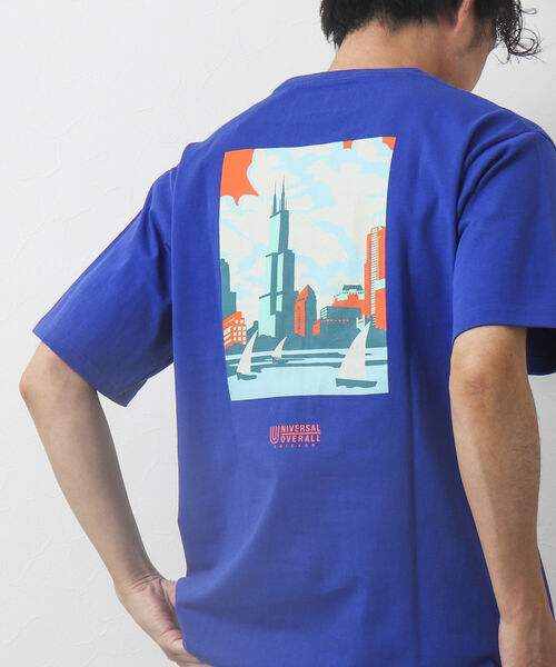 UNIVERSAL OVERALL(ユニバーサルオーバーオール)の「【UNIVERSAL OVERALL/ユニバーサル オーバーオール】別注WINDYCITY Tシャツ(Tシャツ/カットソー・メンズ・ホワイト/イエロー/ブルー/キナリ・M/L/XL)」の1枚目の写真