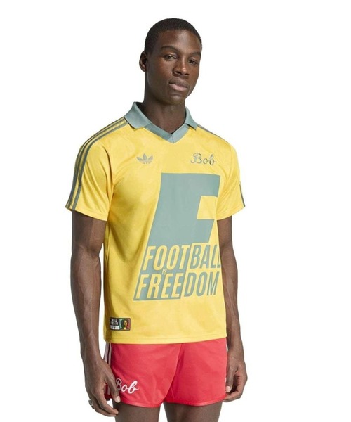 adidas(アディダス)の「BOB MARLEY ORIGINALS JERSEY KA8907(Tシャツ/カットソー・メンズ・イエロー・XX-LARGE/X-LARGE/LARGE)」の1枚目の写真