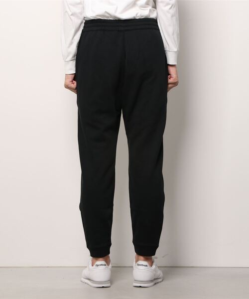 Reebok（リーボック）の「トレーニング エッセンシャルズ パイピング ジョガーズ / Training Essentials Piping Joggers（スウェットパンツ・メンズ・ブラック/ネイビー・XXX-LARGE/MEDIUM/LARGE/X-LARGE/SMALL/XX-LARGE/X-SMALL）」の9枚目の写真