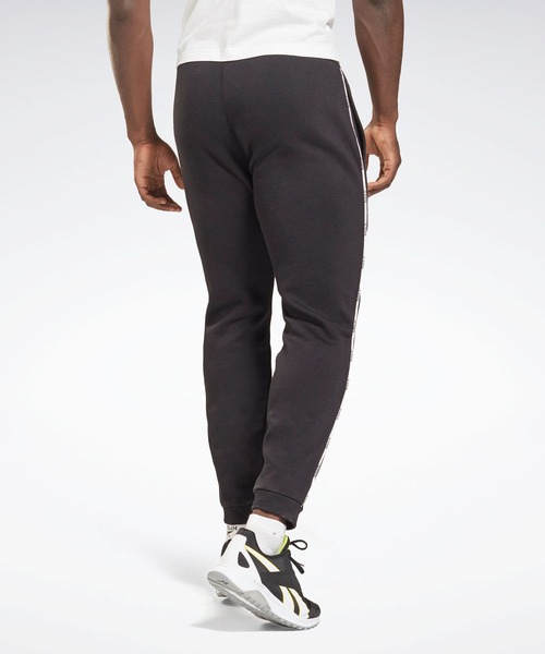 Reebok（リーボック）の「トレーニング エッセンシャルズ パイピング ジョガーズ / Training Essentials Piping Joggers（スウェットパンツ・メンズ・ブラック/ネイビー・XXX-LARGE/MEDIUM/LARGE/X-LARGE/SMALL/XX-LARGE/X-SMALL）」の10枚目の写真