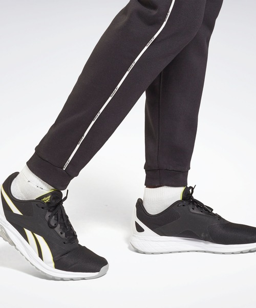 Reebok（リーボック）の「トレーニング エッセンシャルズ パイピング ジョガーズ / Training Essentials Piping Joggers（スウェットパンツ・メンズ・ブラック/ネイビー・XXX-LARGE/MEDIUM/LARGE/X-LARGE/SMALL/XX-LARGE/X-SMALL）」の6枚目の写真