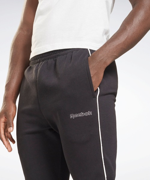 Reebok（リーボック）の「トレーニング エッセンシャルズ パイピング ジョガーズ / Training Essentials Piping Joggers（スウェットパンツ・メンズ・ブラック/ネイビー・XXX-LARGE/MEDIUM/LARGE/X-LARGE/SMALL/XX-LARGE/X-SMALL）」の7枚目の写真